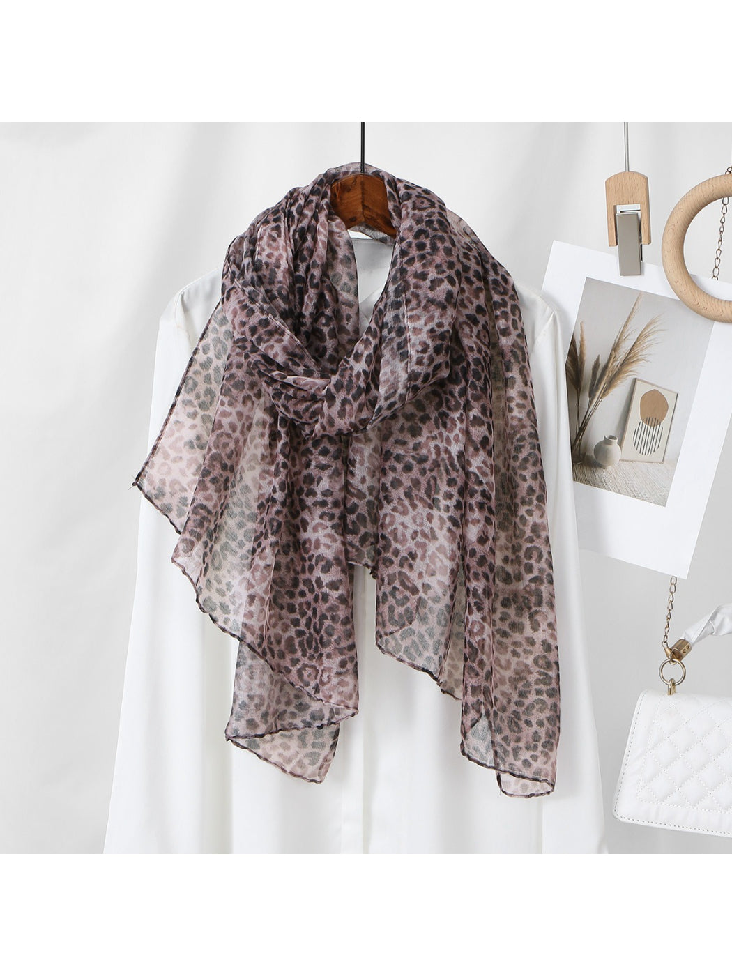 Model wearing the soft leopard pattern summer scarf styled around neck