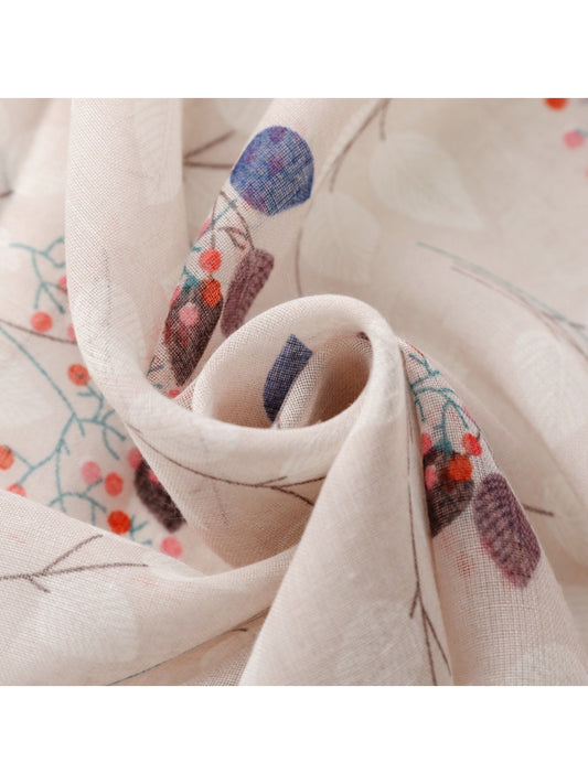 Close-up of scarf fabric highlighting delicate botanical pattern and texture