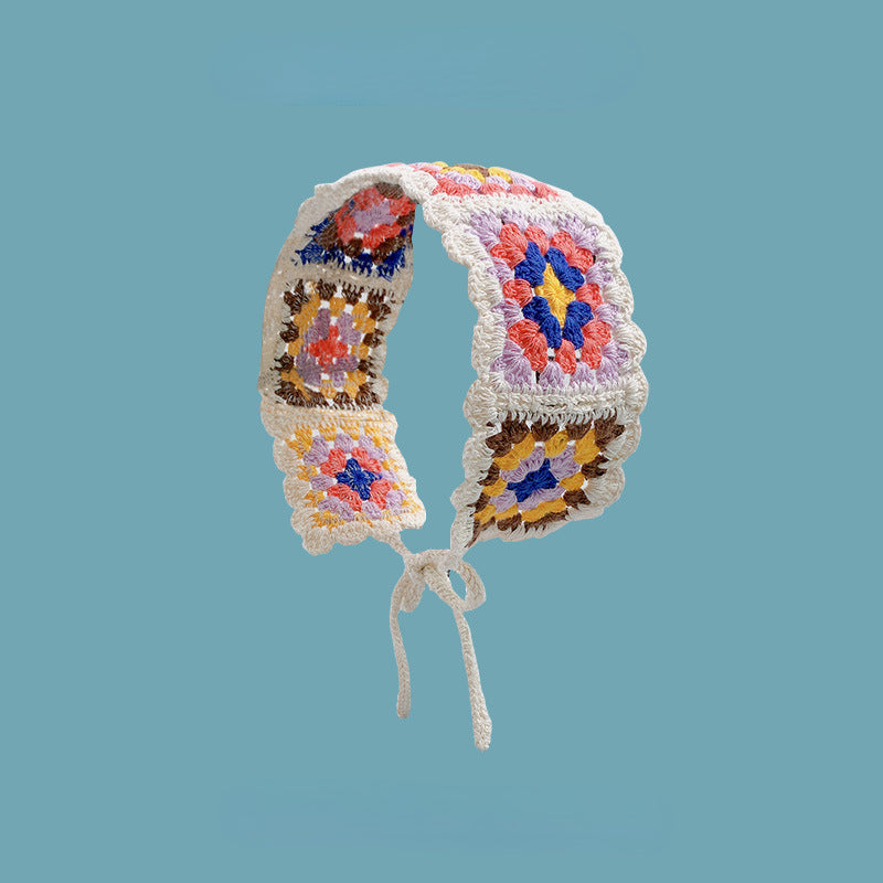 Scarvii crochet floral hairband displayed with a focus on the floral arrangement