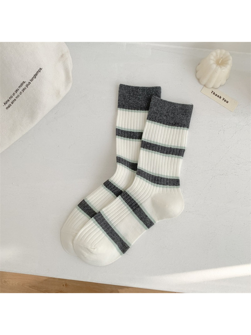 Flat lay of Rufia everyday crew socks with playful stripes arranged in a fan shape