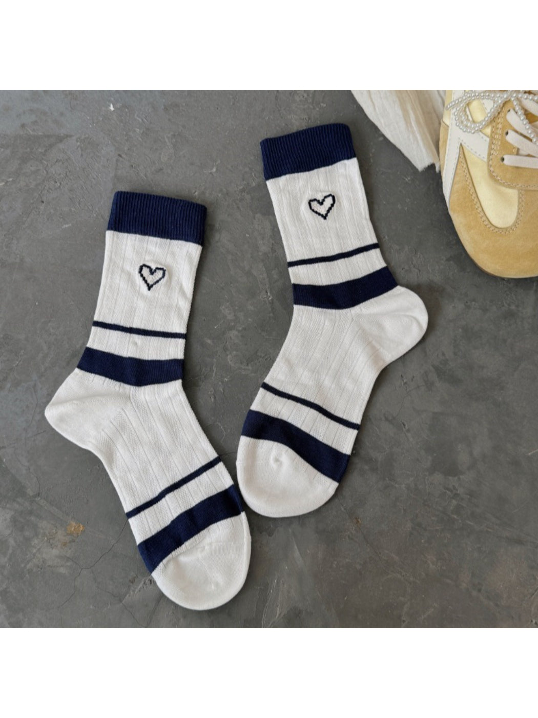 Rufia soft socks with heart pattern styled with rolled-up jeans