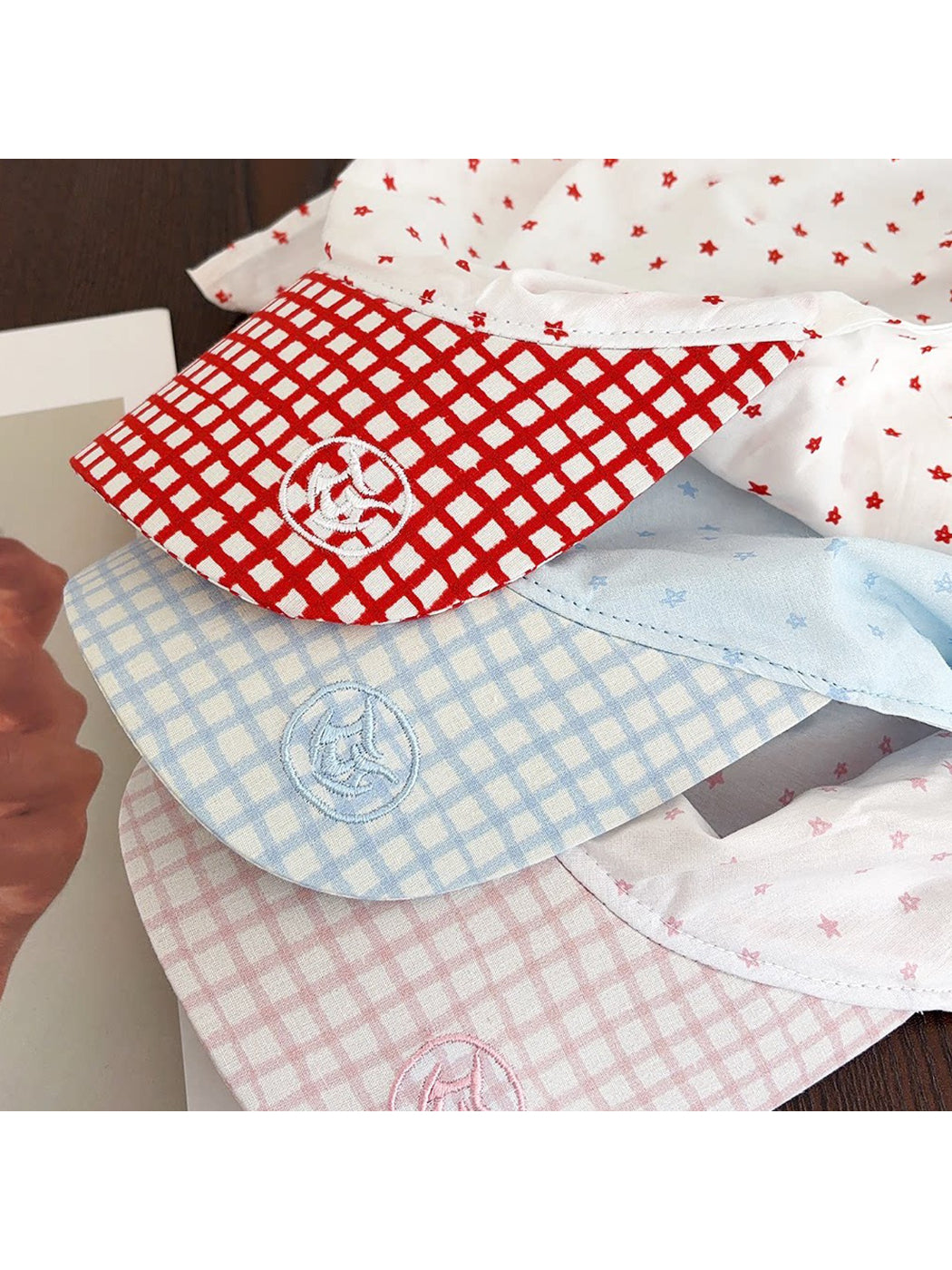 Angled view of Haila plaid star pattern baseball cap displaying star design