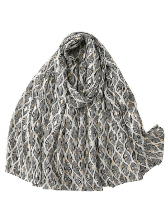 Close-up of feather pattern on soft fabric scarf showing detailed texture and pastel hues