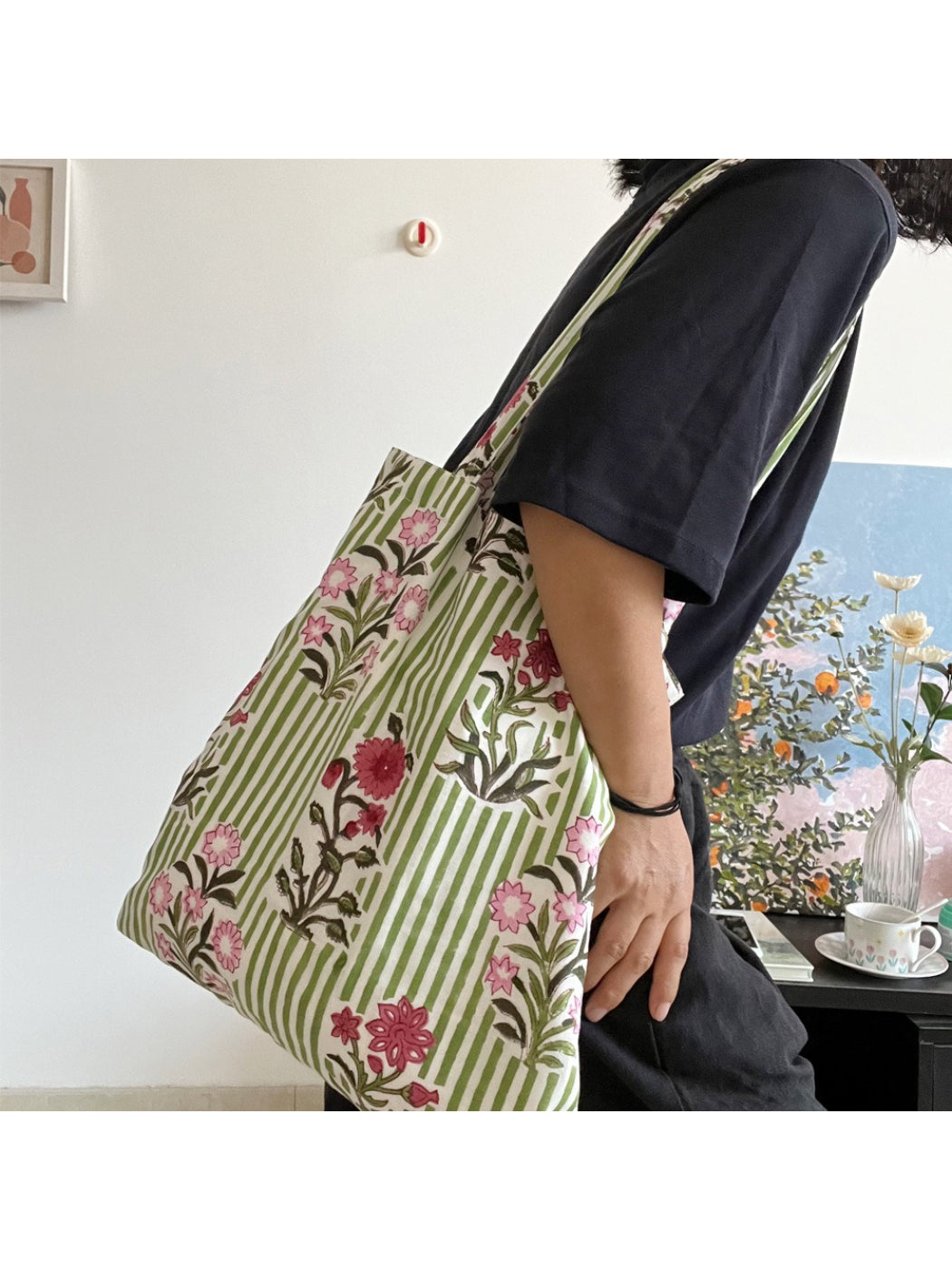 Cosbai floral stripe shoulder tote bag hanging with rabbit charm visible