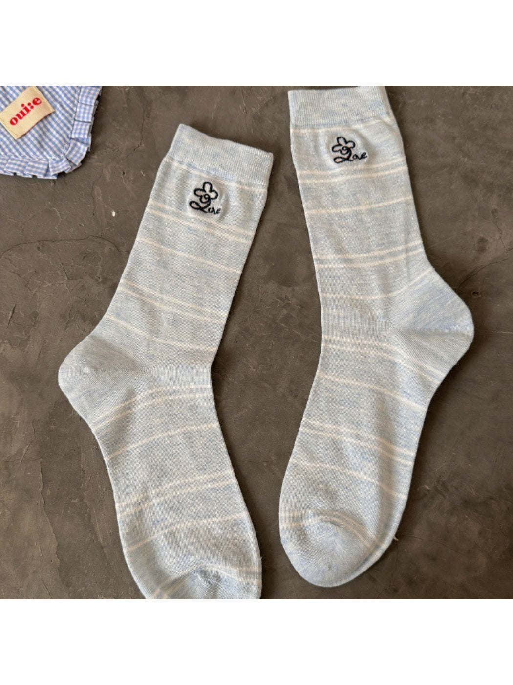 Close-up of Rufia pastel stripe knit socks toe and heel areas in pastel colors