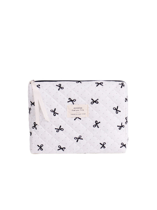 Close-up of Cosbai quilted cosmetic pouch featuring bow print design