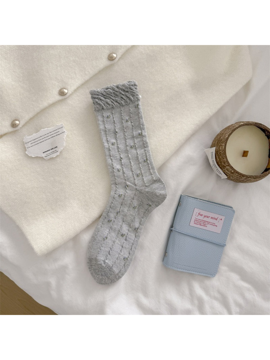 Packaging of Rufia bead detail floral crew socks with branding visible