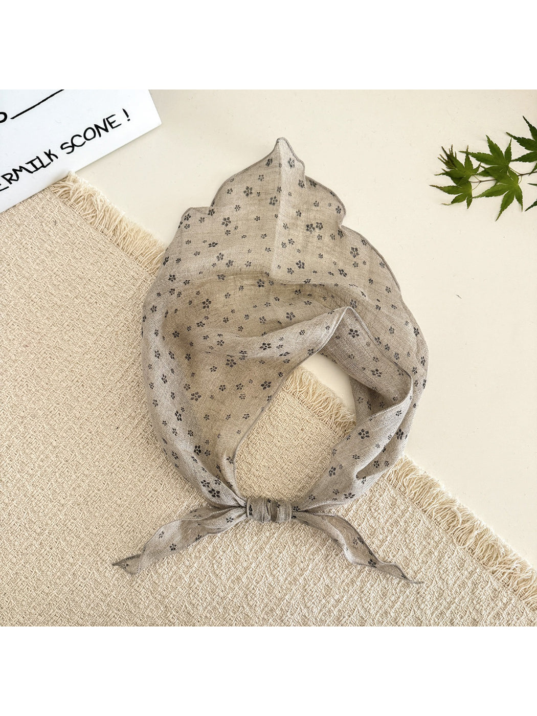 Scarvii lightweight textured tie head scarf displayed flat showing full length