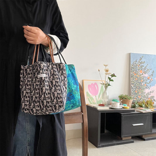 Side view of Cosbai Mixed Print Everyday Carryall Handbag showing strap and pattern details