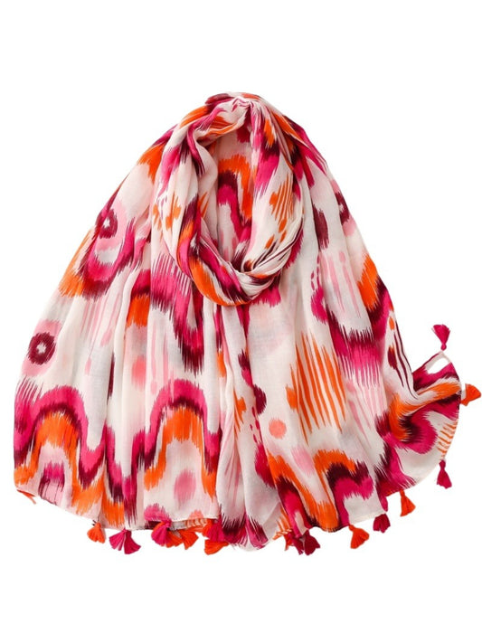 Close-up of Scarvii Boho Ikat Tassel Wrap fabric texture and detailed ikat design