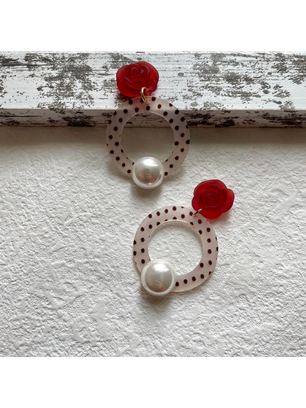 Side view of Earwish Polka Dot Ring Drop Earrings with silver ring and polka dot detail