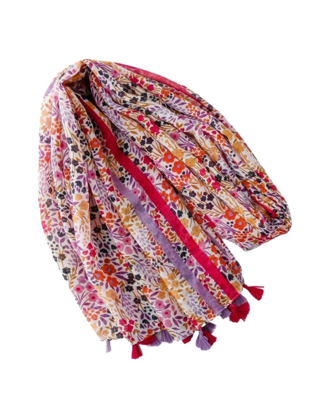 Bright floral scarf draped over a chair highlighting tassel trim