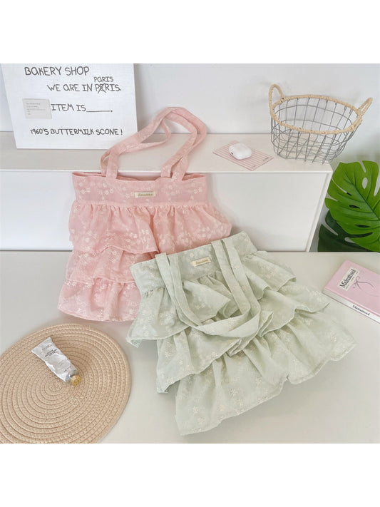 Side angle of Cosbai Romantic Tiered Ruffle Tote Bag showing ruffle tiers
