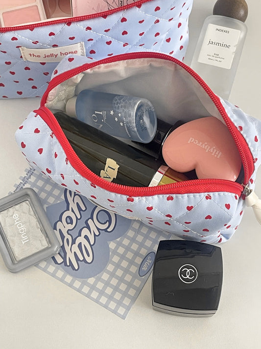 Close-up of blue quilted heart design and on Cosbai makeup bag