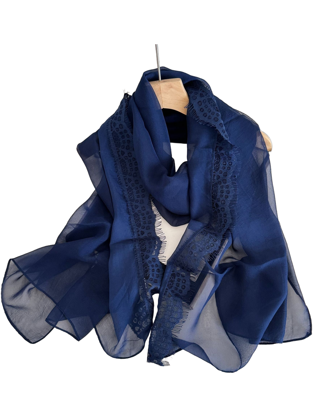 Navy scarf draped in a loop with sheer panels and lace borders