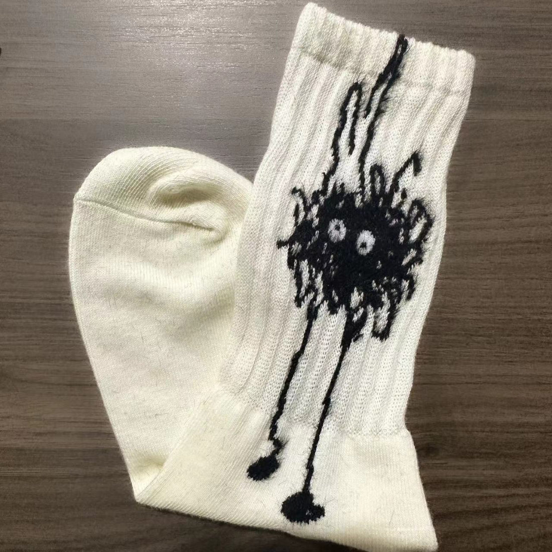 Folded Rufia abstract spot graphic socks with black and white pattern