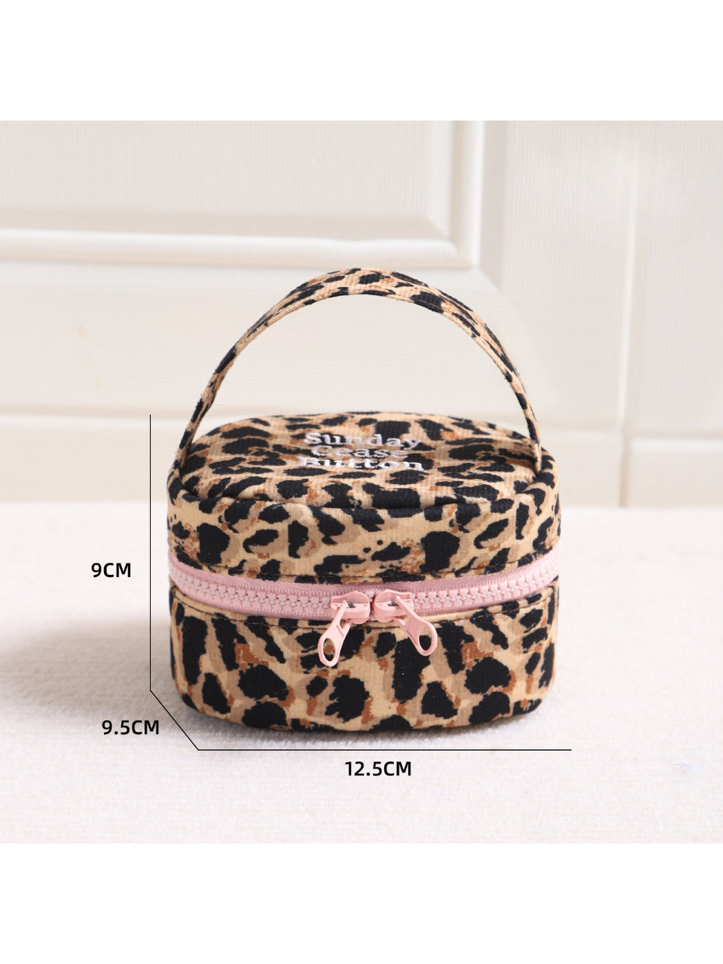 Cosbai leopard round makeup organizer bag with zipper partially open