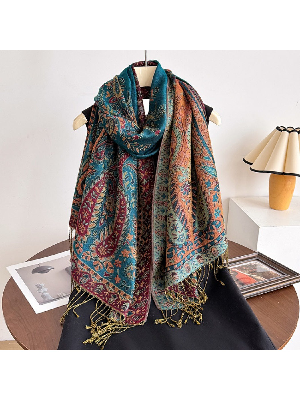 Bohemian paisley tassel wrap scarf laid out with tassels spread for detail