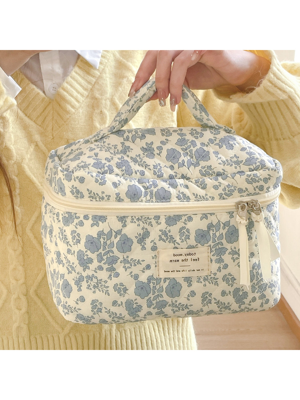 Cosbai blue floral quilted vanity bag displayed on a white background