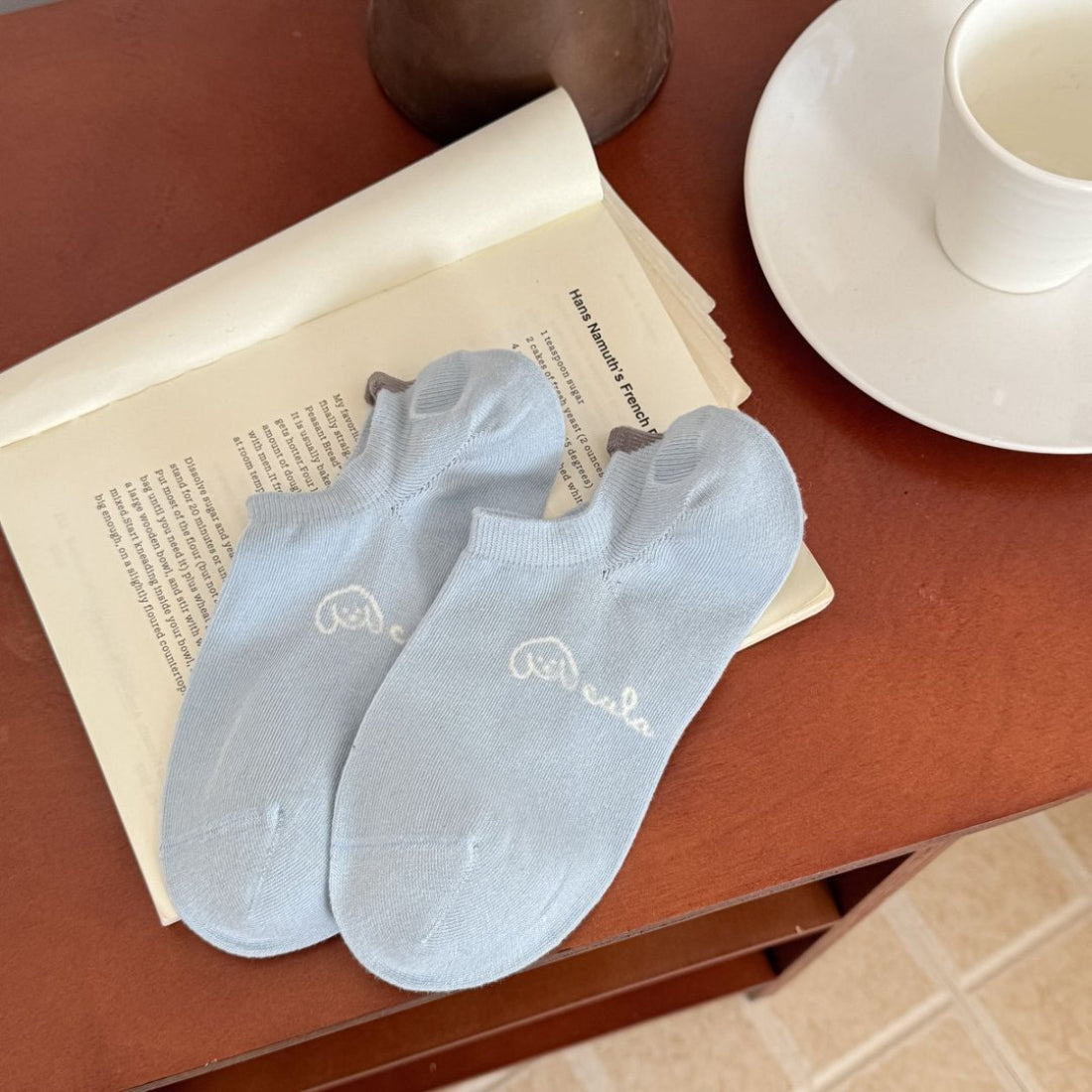 Rufia Soft Spot low cut socks paired with rolled-up jeans on a model