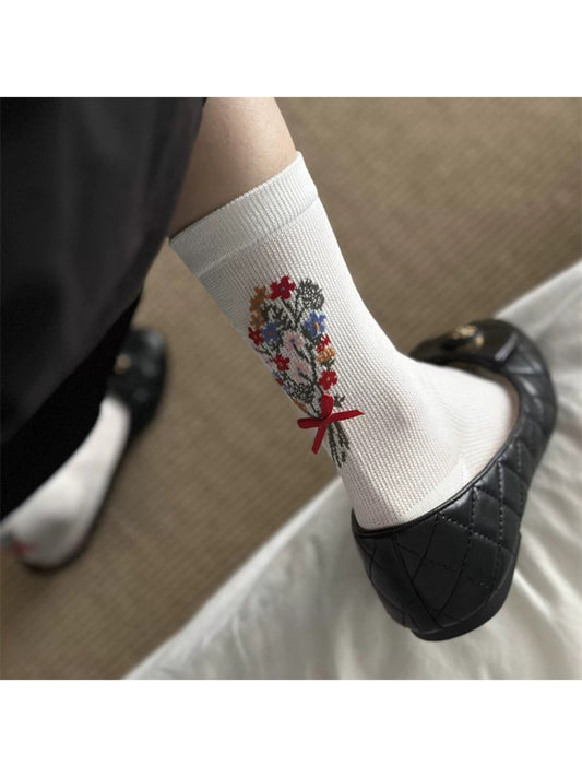 Close-up of Rufia floral bow ankle socks highlighting floral knit design