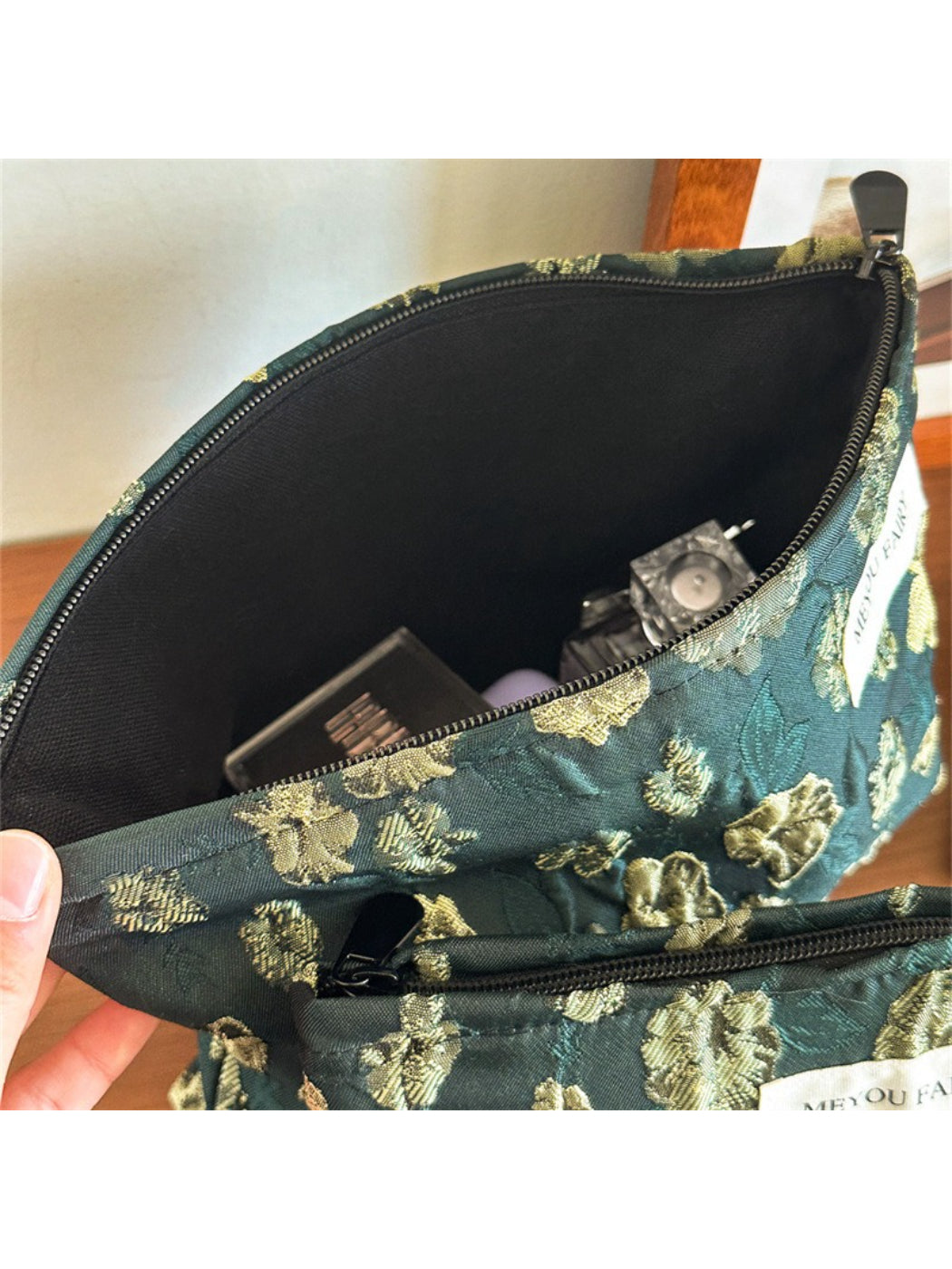 Cosbai elegant floral makeup pouch next to cosmetic brushes