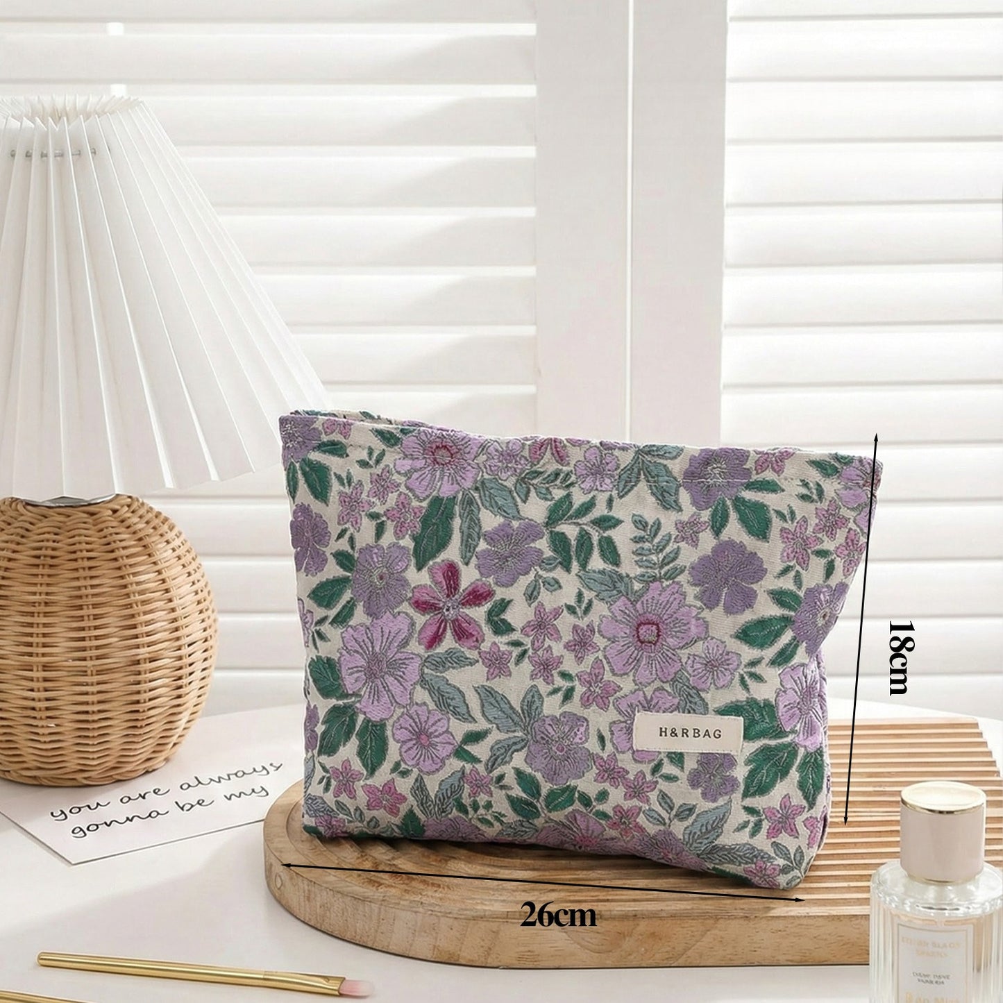 Cosbai textured flower cosmetic bag with chain strap shown from side angle