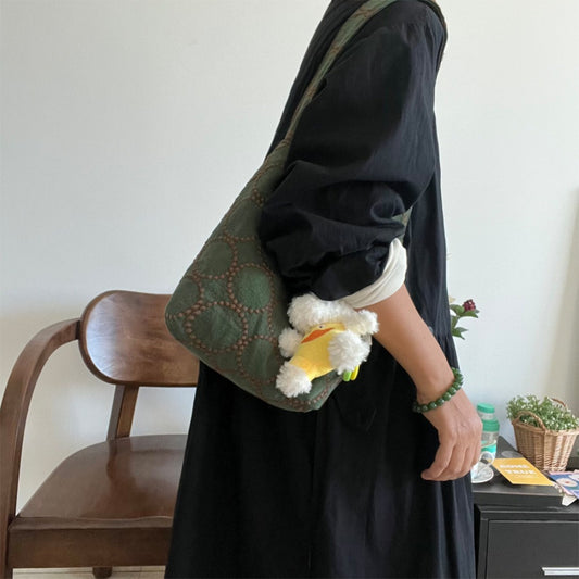 Side view of Cosbai Olive Stitch Slouchy Shoulder Bag showing shoulder strap and texture