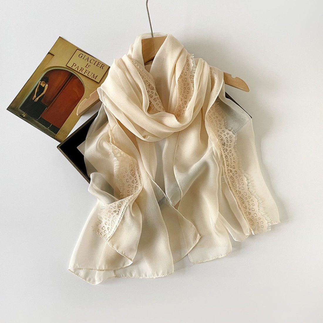 Lightweight scarf with lace border styled as a head wrap on model