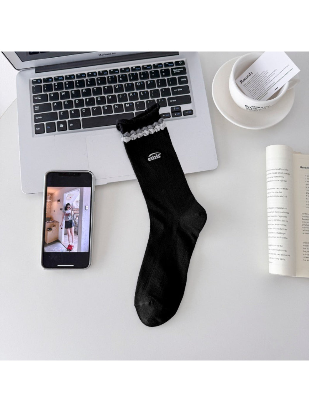 Rufia contrast braid knit socks styled with casual footwear on a wooden floor