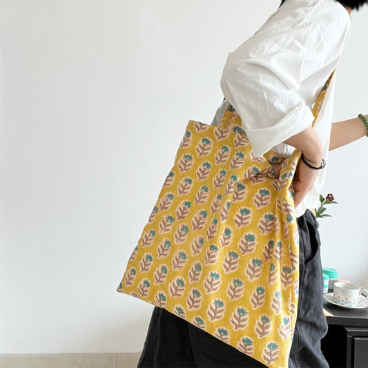 Yellow floral everyday tote bag detail view