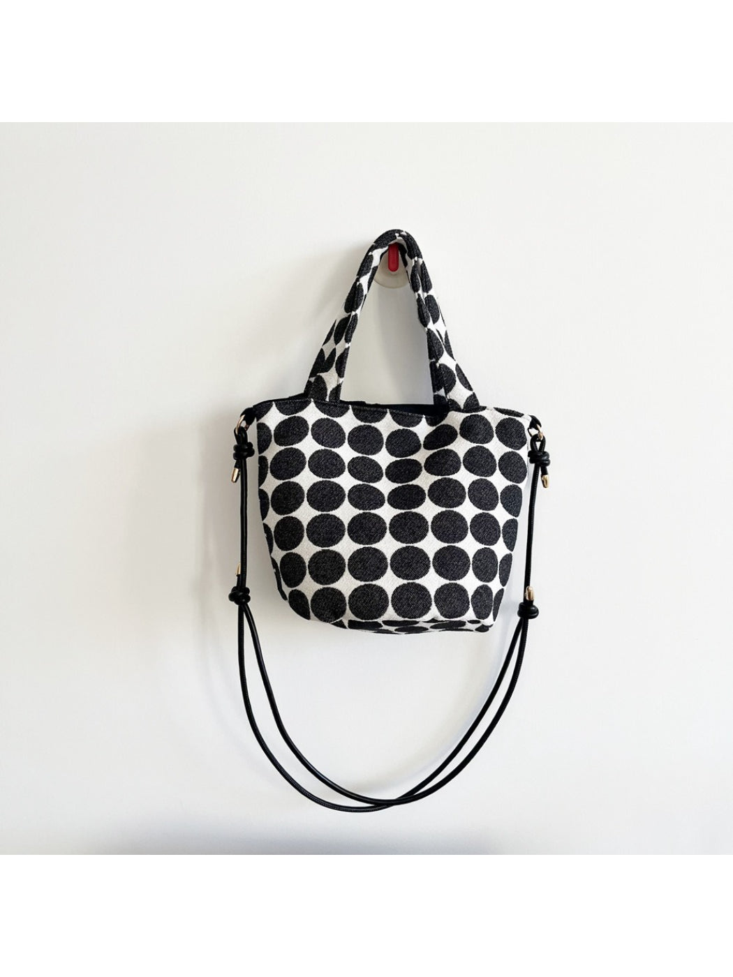 Cosbai Polka Dot Mini Tote Bag placed on white surface highlighting shape and pattern