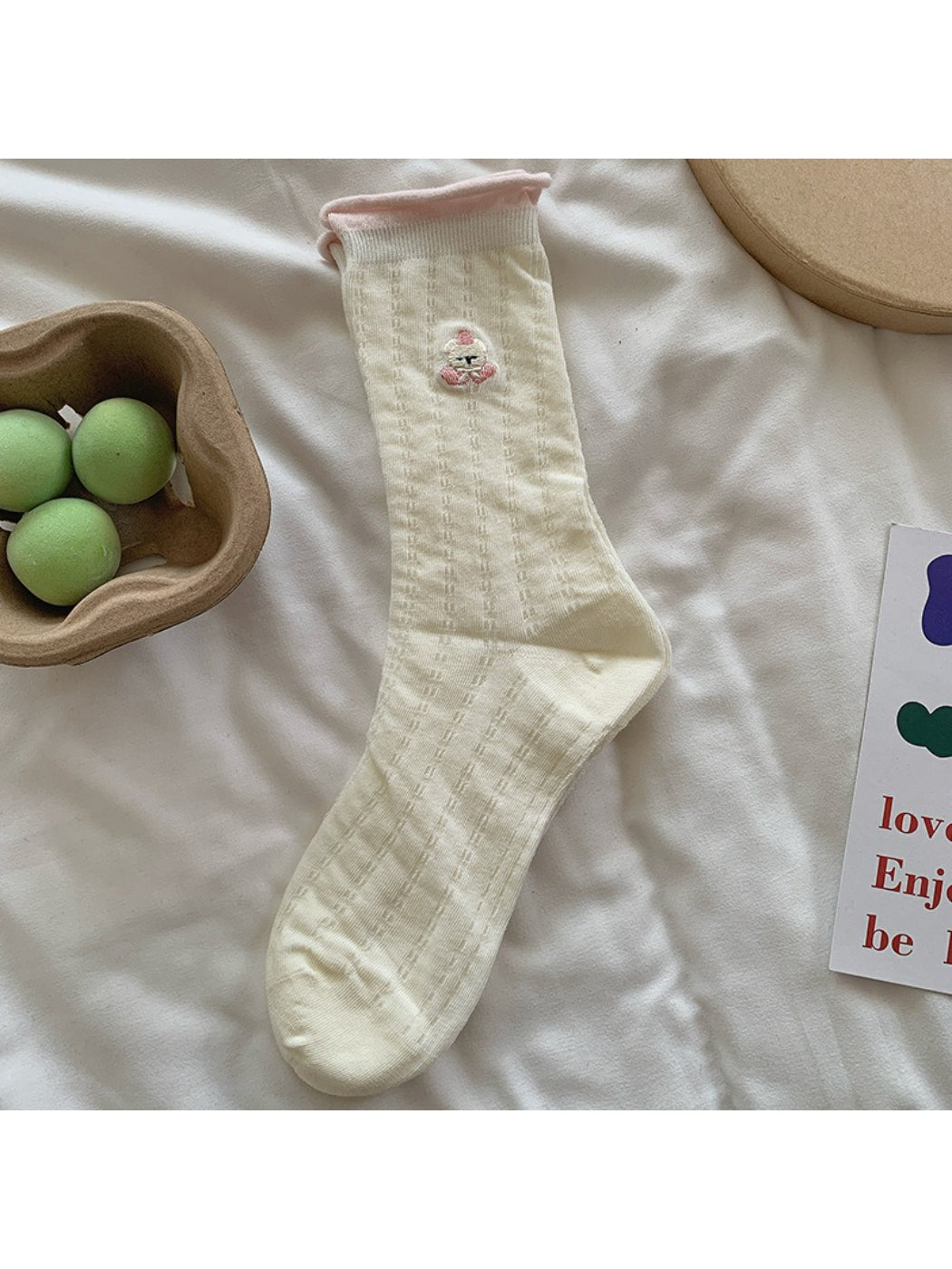 Packaging of Rufia soft roll cuff character socks with branding and product label
