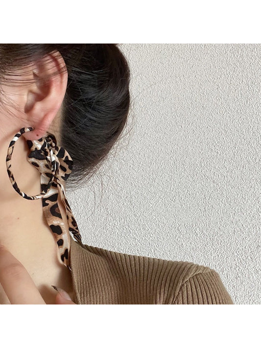Side view of Leopard Ribbon Hoop Earrings showing the hoop shape and fabric ribbon pattern