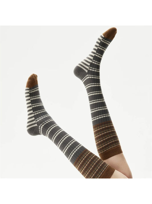 Close-up of Rufia crew socks showing layered fabric and stripe details