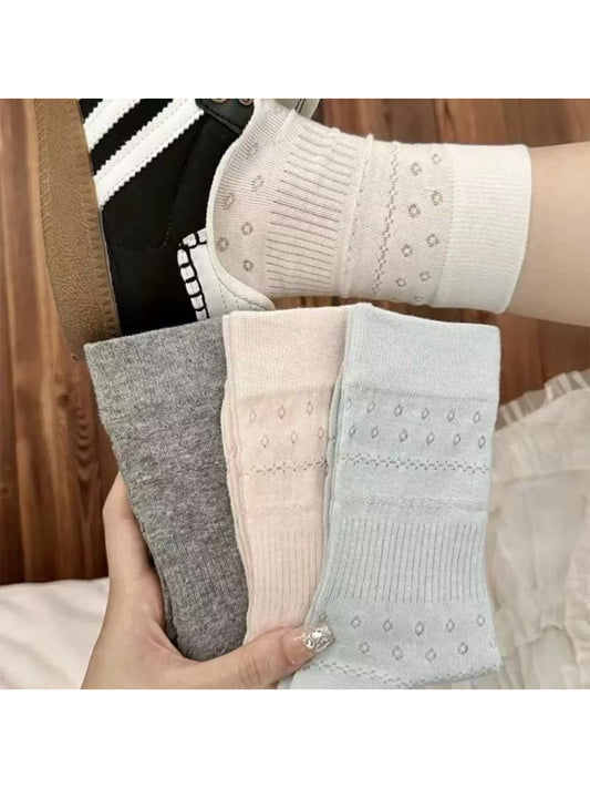 Close-up of Rufia Dot Floral mid-calf socks highlighting floral dot design