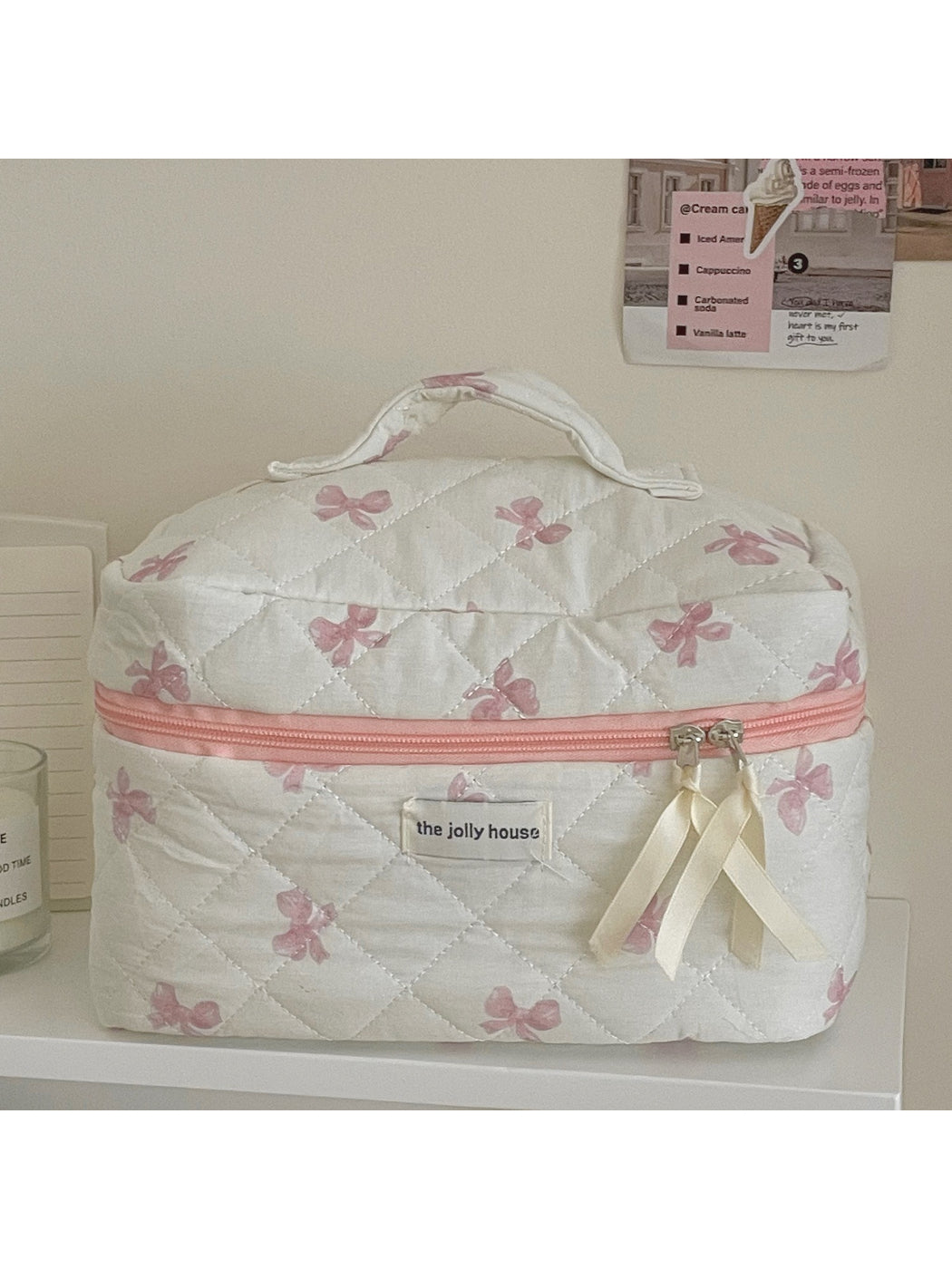 Cosbai Quilted Bow Cosmetic Case displayed on a vanity table with makeup items