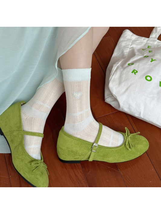 Close-up of Rufia heart socks showing soft fabric and colourblock pattern
