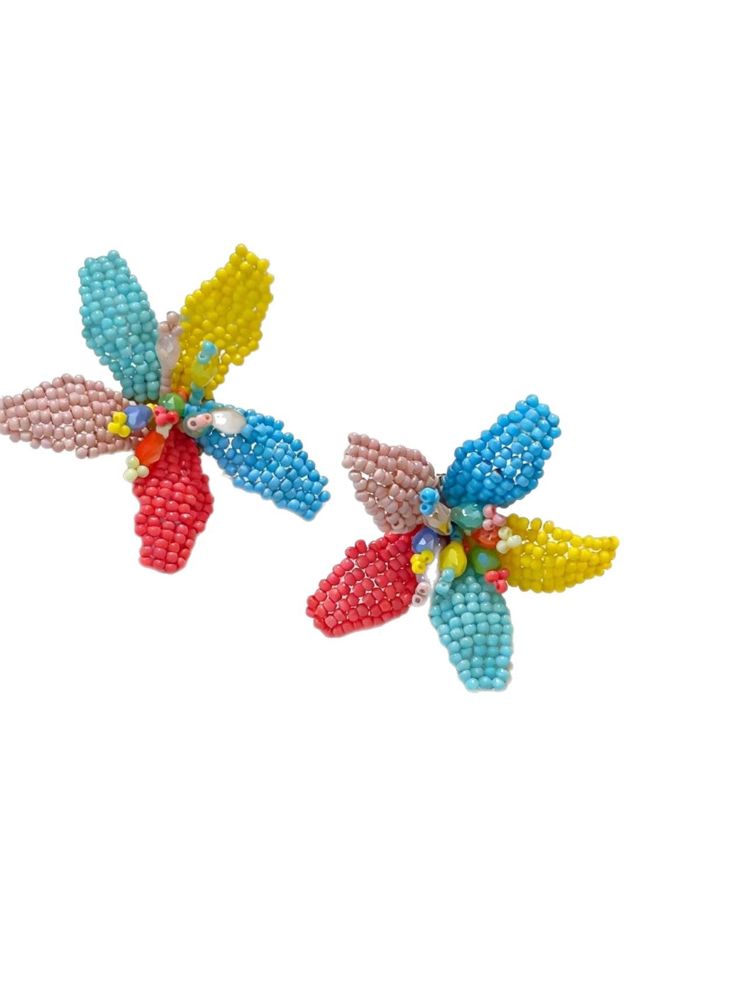 Model wearing Earwish colorful beaded flower earrings with multicolored petals