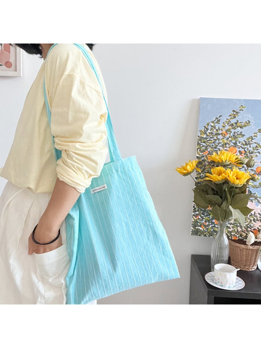 Close-up of sky blue textured material and stitching on Cosbai tote bag