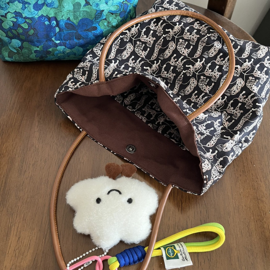 Cosbai Mixed Print Everyday Carryall Handbag worn over shoulder by model in casual outfit