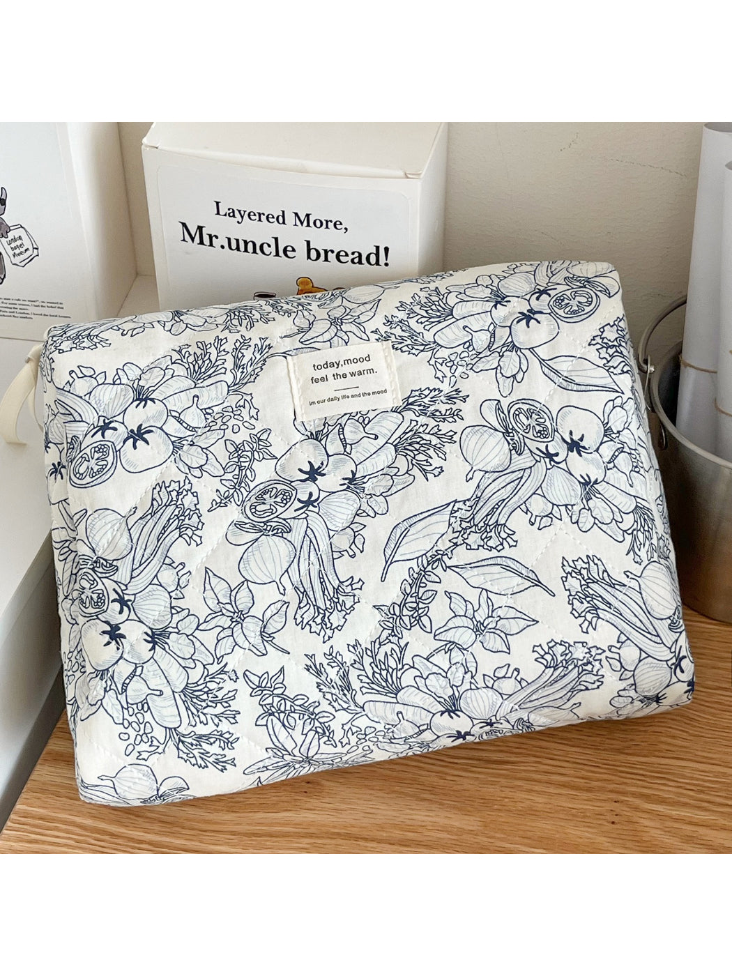 Inside view of Cosbai quilted botanical makeup bag showing spacious interior