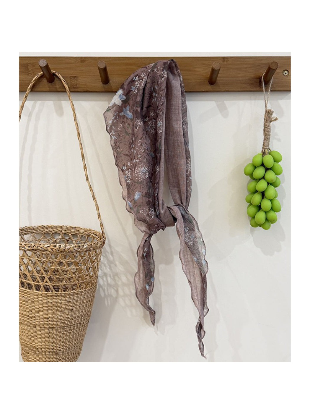 Lightweight botanical triangle scarf styled with casual outfit on model