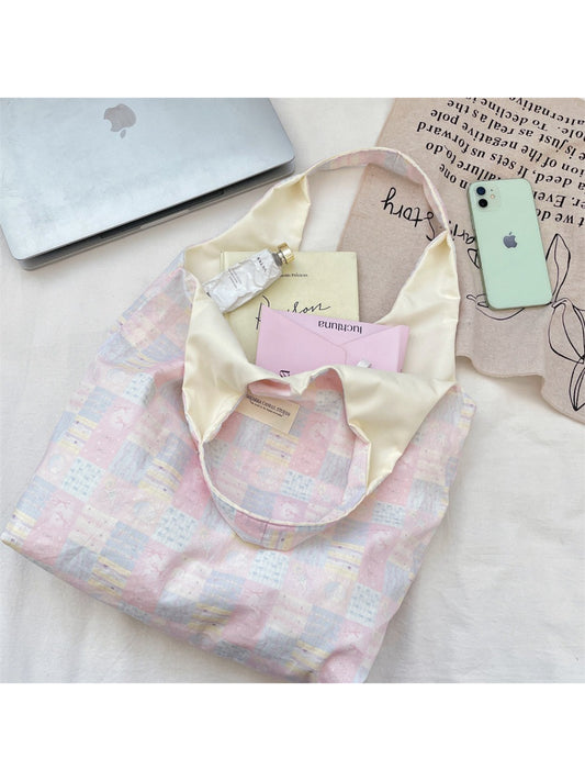 Close-up of Cosbai tote bag showing patchwork stitching and slouchy design