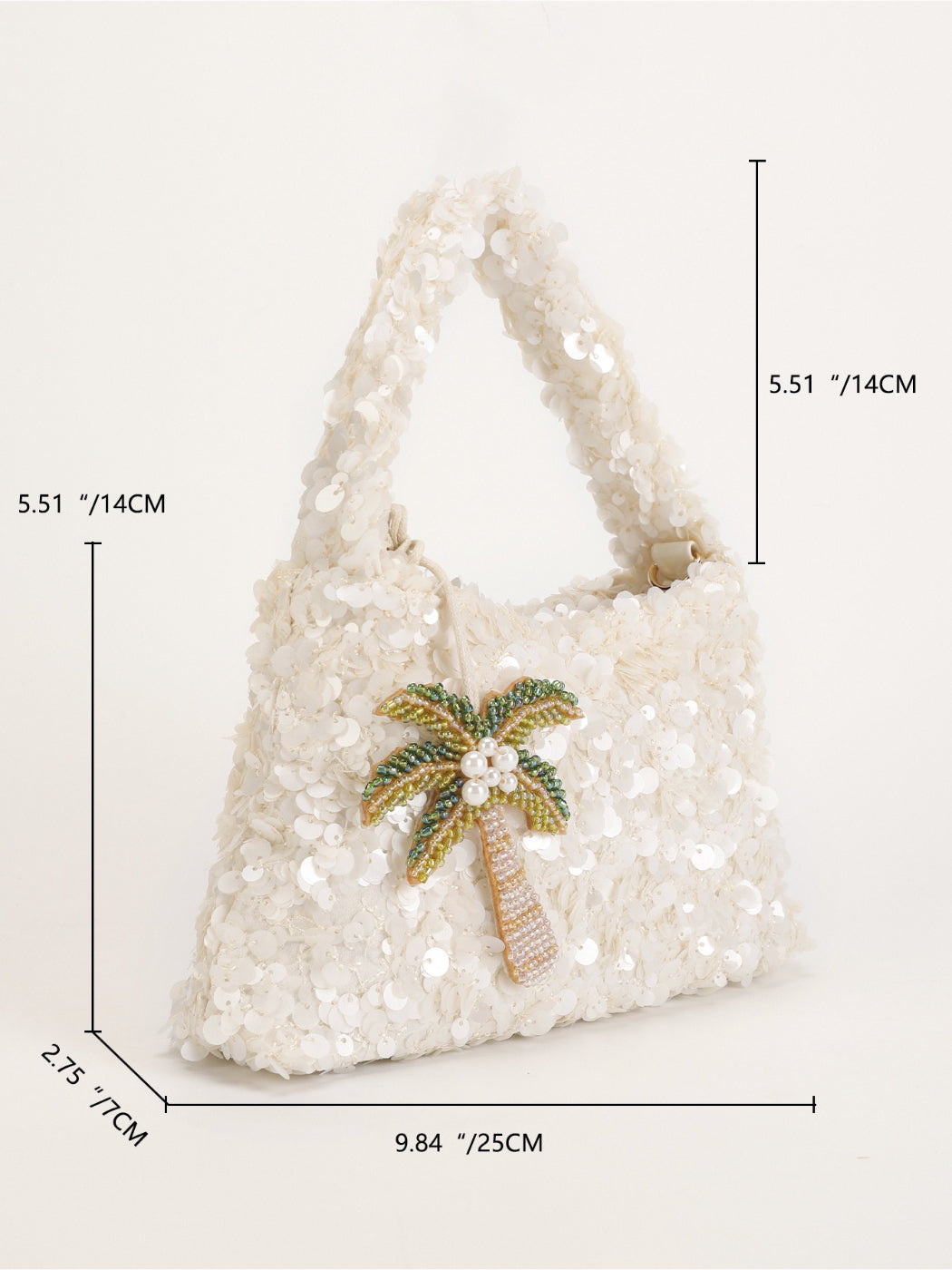 Model holding Cosbai Tropical Sequin Handbag with tropical leaf pattern and gold chain