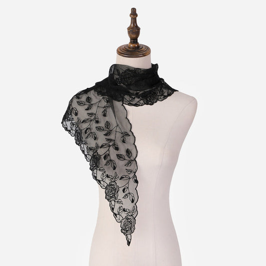 Close-up of Haila head scarf fabric with detailed rose mesh design