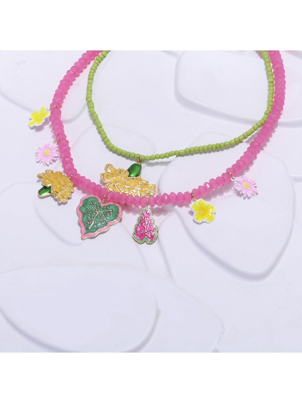 Neckit Summer Fruit Necklace laid flat highlighting the arrangement of fruit and floral charms