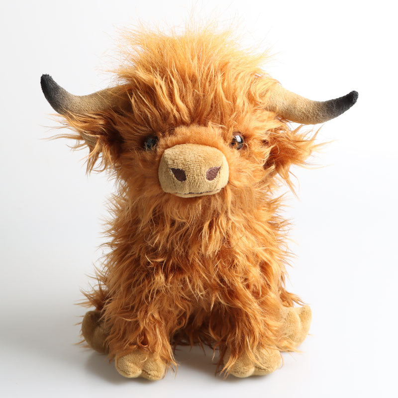 Black and white cow plush toy side view