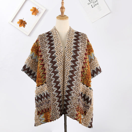 Scarvii boho shawl with pocket draped over a surface highlighting fabric details