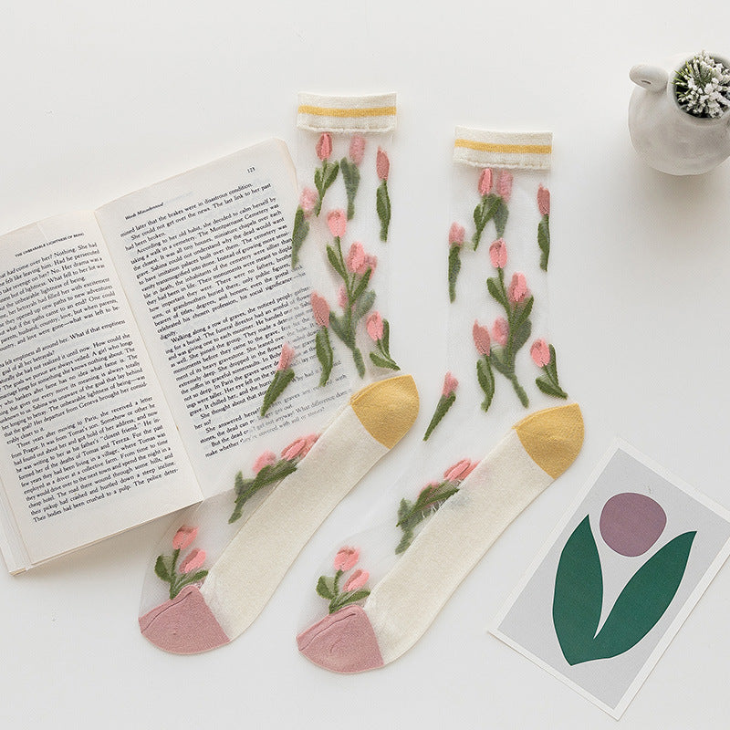 Rufia mesh tulip pattern crew socks shown from an angle emphasizing the pattern